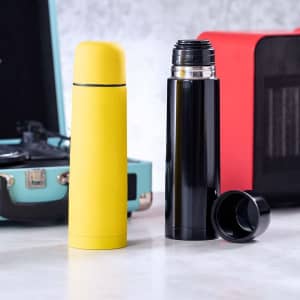 A drink bottle in yellow and a black vacuum flask, both with lids, placed against a textured backdrop.