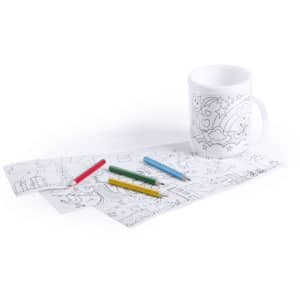 A white coffee mug with a colouring design, accompanied by four coloured pencils in red, green, blue, and yellow.
