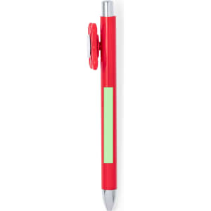 A red pen with a green accent and a circular clip. The pen features a silver tip and has a branding logo.