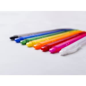 A row of plastic pens in various colours, including black, blue, green, yellow, orange, pink, and white, with logos.