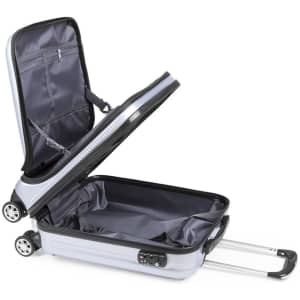 A wheeled grey trolley bag with a spacious interior and retractable handle, featuring a zipper and wheels.