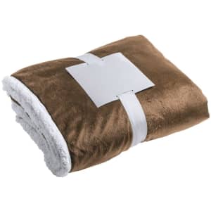 A folded brown blanket with a white underside, secured with a white band. The blanket has a soft texture.