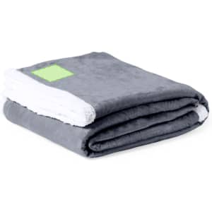 A folded grey blanket with a white underside, featuring a small logo in one corner.