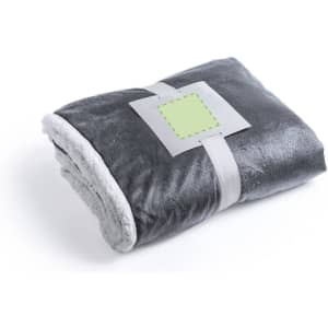 A folded grey blanket with a soft texture and a light grey underside, secured with a band featuring a logo.