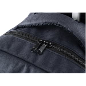 A close-up of a navy blue backpack featuring a zippered pocket and a textured fabric. The bag has a logo.