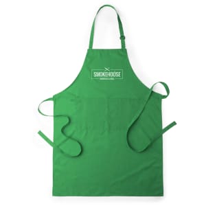 A green apron featuring a central pocket and ties at the back, complete with a logo at the top.