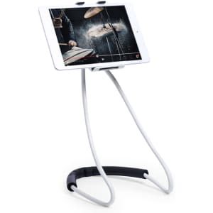 A phone stand in white and black, holding a tablet horizontally, displaying a video of drumming.