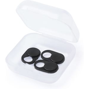 A clear case containing four black webcam covers. The covers are circular with a sliding mechanism.