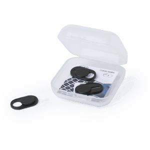 A clear case containing black webcam covers sits open, revealing two covers inside and one outside.