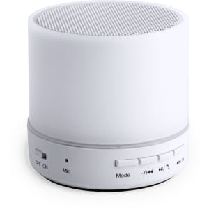 A white circular speaker with a mesh top and control buttons on the side. It features a compact design and is portable.