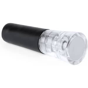 A drink bottle stopper in black and clear, designed for vacuum sealing bottles. It features a smooth, rounded top.
