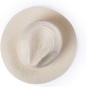 A beige straw hat with a circular design, featuring a wide brim and a textured surface.