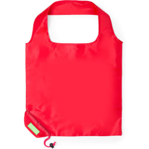 A bright red foldable bag with a rounded handle, featuring a small pouch for storage. It has one logo on the side.