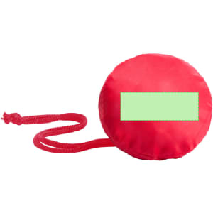A round, red foldable bag with a green rectangle for branding and a drawstring attachment.
