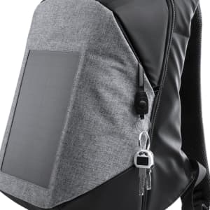A grey and black charger backpack featuring a solar panel and a keychain attached.