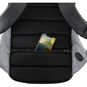A black and grey backpack with a mesh back pocket containing a smartphone. The bag features a logo.