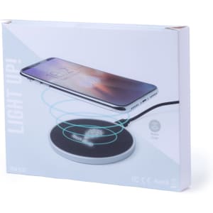 A wireless charger with a sleek black and silver design, featuring a smartphone positioned on top.