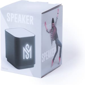 A black speaker in a cube-shaped box, featuring a logo and a vibrant design on the packaging.
