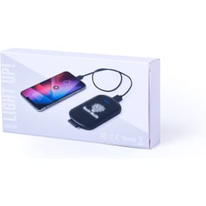 A black Simmon Power Bank with a charging cable, displayed alongside a smartphone, packaged in a box.