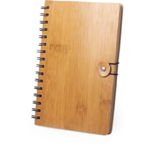 A bamboo spiral notebook featuring a button closure. The cover is natural wood with a smooth finish.
