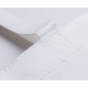 A close-up of a white tote bag, featuring stitching and a strap, with a logo present.