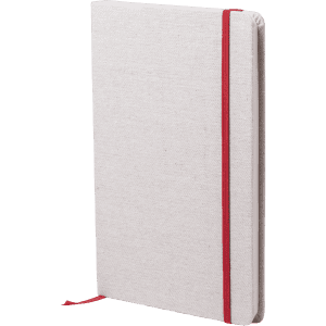 A grey notepad with a textured cover, secured with a red elastic band and featuring a ribbon bookmark.