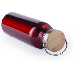 A drink bottle in a deep red colour with a bamboo lid and metal handle. Brand logo is visible on the bottle.