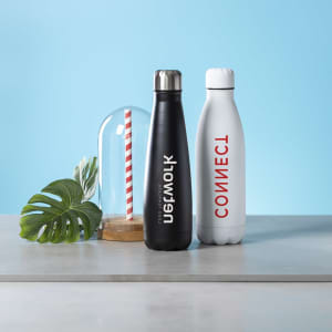 A drink bottle in black and a drink bottle in white, both with sleek designs and logos, displayed on a countertop.