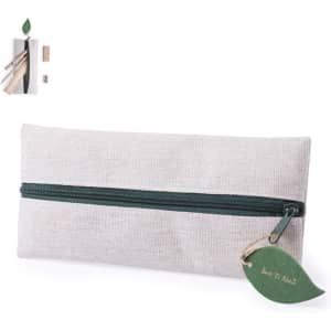 A grey pencil case with a green zipper and tag, featuring a logo and accompanied by wooden stationery items.
