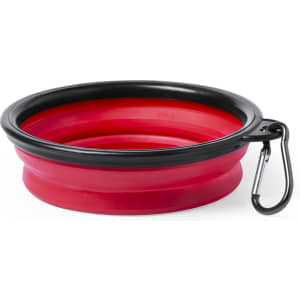 A collapsible pet bowl in red with a black rim, featuring a carabiner for easy attachment.