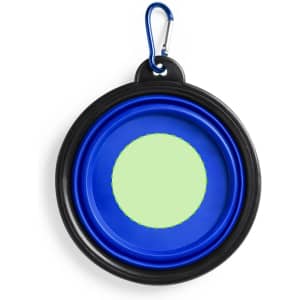 A blue and black collapsible pet bowl with a carabiner attachment. It features a round shape and a green centre.