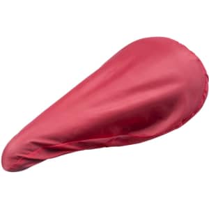 A red saddle cover featuring a fitted design and smooth texture. Includes branding on the exterior.