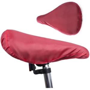 A red saddle cover positioned on a bicycle seat with another cover shown above it. It features a logo.