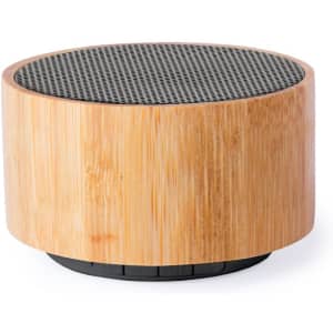A round speaker with a bamboo outer casing and a black mesh top. It features a branding logo on the base.