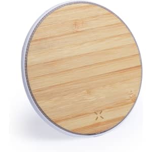 A round wireless charger featuring a bamboo top and a silver base. It has a minimalist design with a logo.