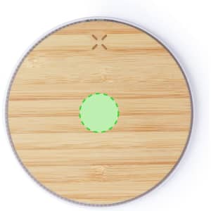 A round wireless charger with a bamboo surface and a green circular indicator in the centre, featuring a logo.
