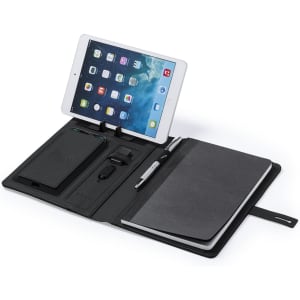 A black multifunction notepad with a tablet holder, wireless charger, pen, and notebook. It includes branded elements.