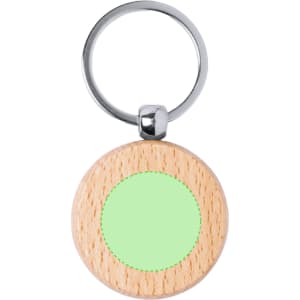 A circular keyring featuring a wooden frame with a light green centre and a metallic ring.