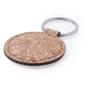 A round keyring made from natural cork with a metallic keyring attachment.