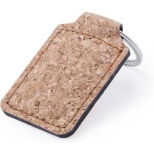 A cork keyring featuring a smooth, natural finish and attached metal ring. The design is minimalist and earthy in colour.