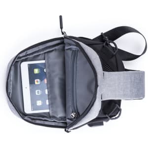 A grey and black shoulder bag with an open compartment featuring an iPad inside. It has a logo on the exterior.