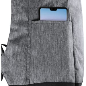 A grey backpack pocket displaying a mobile phone partially inserted. The backpack has a textured fabric and features a logo.