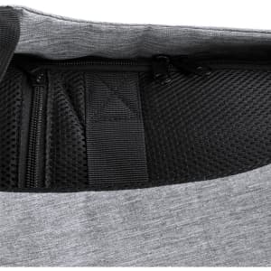 A grey backpack interior featuring mesh pockets and zippers, designed for anti-theft purposes.
