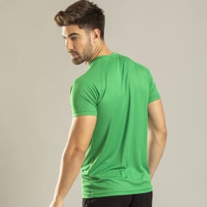 A green T-shirt worn by a male model, featuring a fitted style and short sleeves. The shirt has a logo.