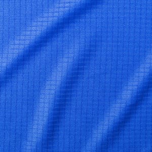 A vibrant blue textured fabric, showcasing a grid pattern suitable for a kids' T-shirt.