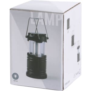 A black lantern with a transparent casing, packaged in a white box featuring a logo.