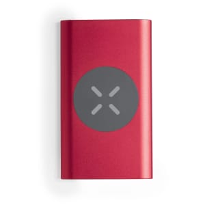 A red power bank with a circular grey logo on one side, designed for charging devices.