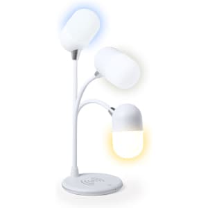 A multifunction lamp in white with three adjustable light sources and a wireless charging base.