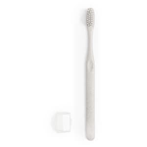 A grey toothbrush with a textured brush head and a protective cap. The product has a simple design and features branding.