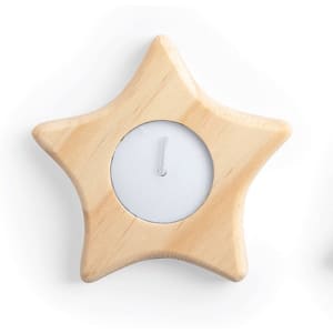 A star-shaped wooden candle holder with a white tea light candle in the centre.